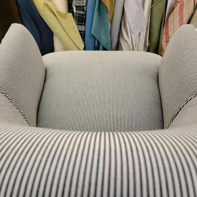 Generously sized swivel chair by Drexel with firm back support and tight cushion newly reupholstered in ticking and faux...