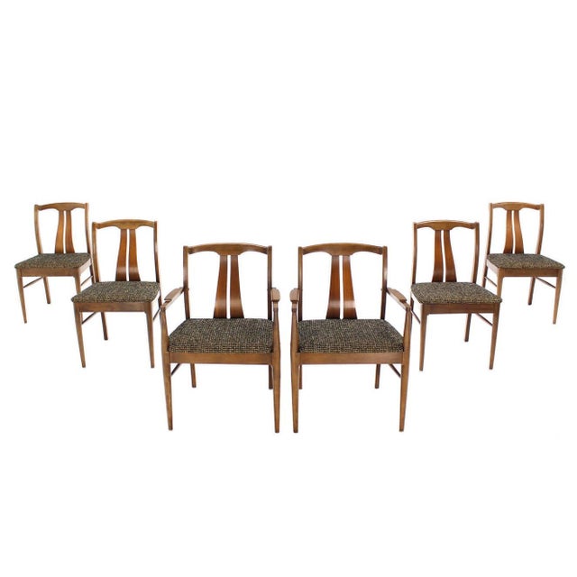 Set of six Mid-Century Modern dining chairs with curved backs and new upholstery.
