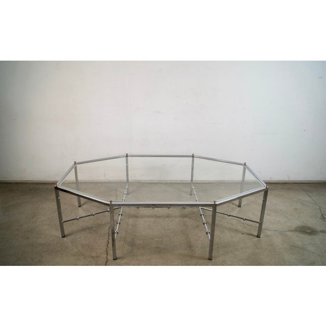 Vintage 1970's Mid century Modern coffee table for sale. It's in great condition, and has an octagon chrome shape with a...