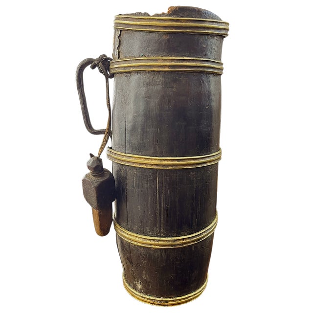 Striking antique wooden flagon constructed in the traditional stave-and-band method, reminiscent of a small barrel form....