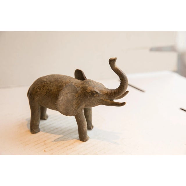 :: Vintage handmade African elephant sculpture. Circa late mid 20th century, though possibly older, this piece has such...
