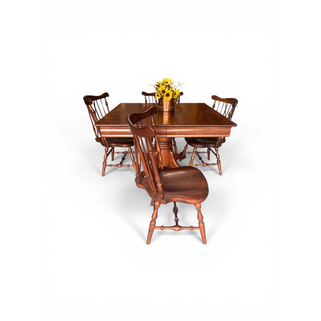 Stunning oak tiger wood/quarter sawn, pedestal table with 4 Fiddleback dining chairs. This set brings The Wow Factor! The...