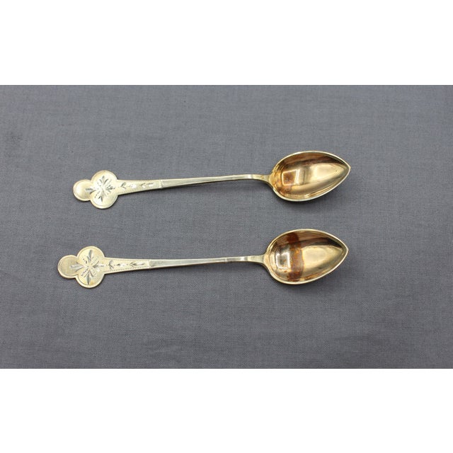 Set of 9 Norwegian gilt 830 standard silver coffee spoons. Early-mid 20th century. Trefoil tips; bright-cut decoration....
