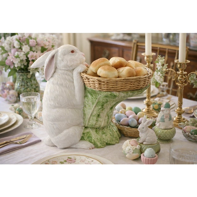 An eye-catching Italian porcelain standing white rabbit supporting a sculptural lettuce-leaf tabletop. Executed in high-...