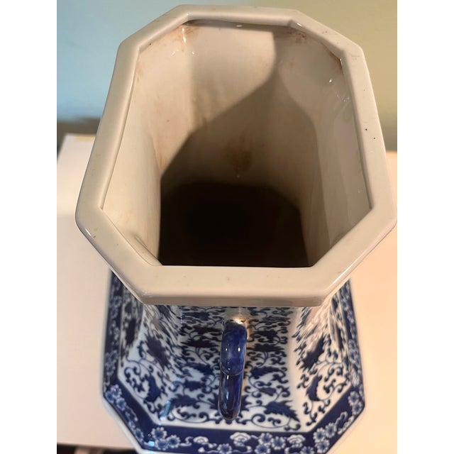 Striking 18-inch Chinese blue and white porcelain hexagonal vase decorated in the classical Qianlong style. The faceted...