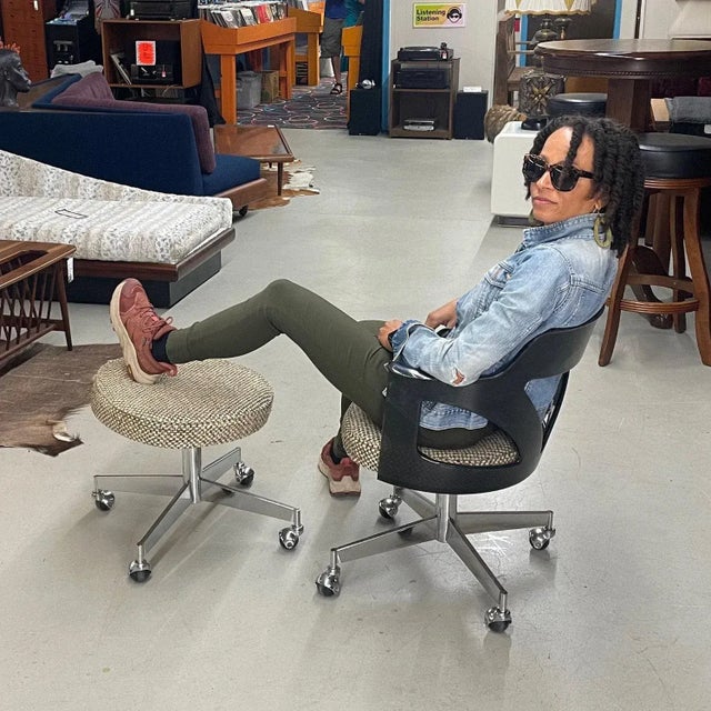 Vintage 1970s Space Age smoked acrylic armchair and a foot stool by Conwed. Our restoration team hand polished this dark...