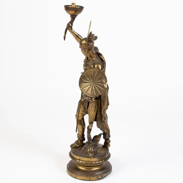 An elegant and rare impressive antique native american bronze sculpture lamp, made to impress and preserve its legacy. The...