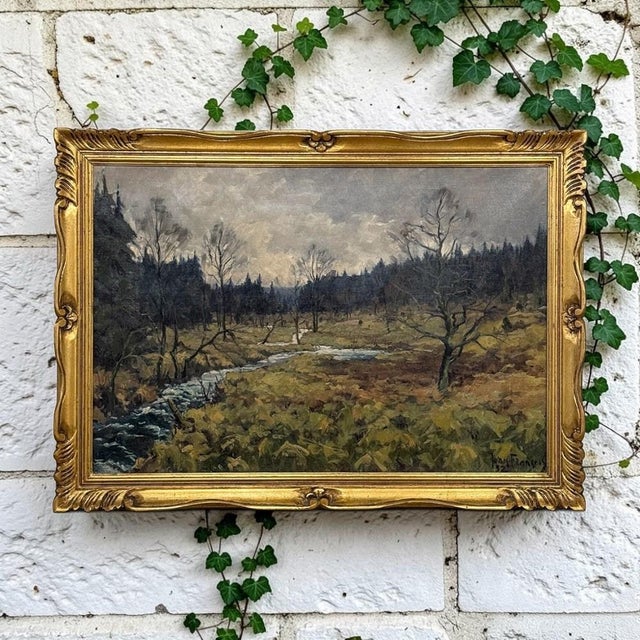 A sweeping Ardennes landscape unfolds beneath an overcast sky in this signed and dated 1952 oil painting on canvas by...