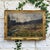 A sweeping Ardennes landscape unfolds beneath an overcast sky in this signed and dated 1952 oil painting on canvas by...