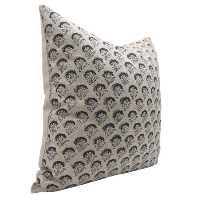 Bring a sense of timeless beauty to your home with this handmade block print cushion cover, showcasing the delicate charm...
