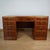 A superb art deco desk by heal's of london. Flame mahogany veneered all round with oak banding and original worn leather...