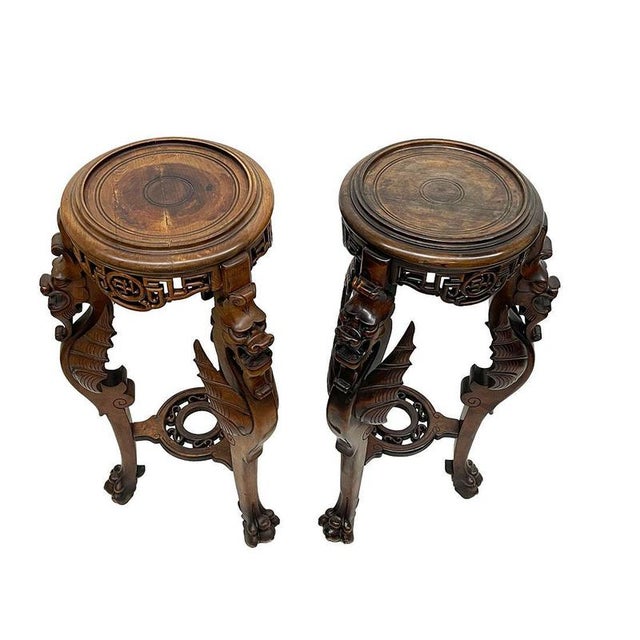 Asian style carved plant table pedestal with Dragons, ca 1920 A three-legged table 91 cm high with a Dragon on a claw foot...