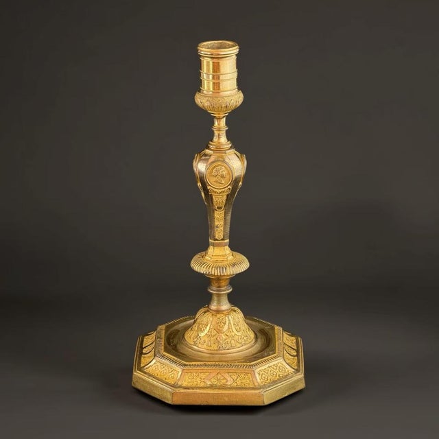 This magnificent French Empire ormolu candlestick presents the pure luxury of early 19th-century Parisian craftsmanship....