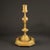 This magnificent French Empire ormolu candlestick presents the pure luxury of early 19th-century Parisian craftsmanship....