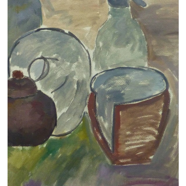 Warmly hued tempera still life of an assortment of pottery and ceramics by Argentine artist Mariano Acha, 1975. Signed and...