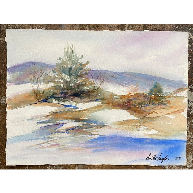 1977 ethereal watercolor on paper landscape of a stream and hills. Signed Smith-Taylor and dated 1977 lower right....