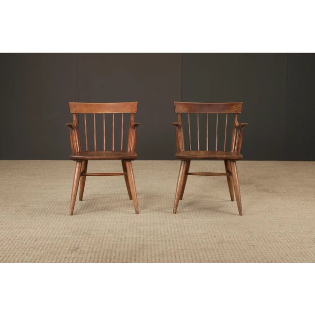 Crafted in the mid-20th century by the esteemed Willett Furniture Company of Louisville, Kentucky, this pair of spindle-...