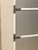A striking tall dresser with a distinctly Mod, Space Age-inspired look. The streamlined gray panels are framed by...
