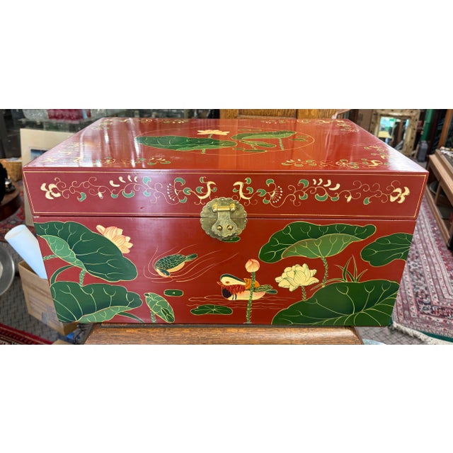 Stunning red lacquer trunk, hand painted, in excellent condition, circa 1970, clean inside and out, lilly pad motif. Trunk...