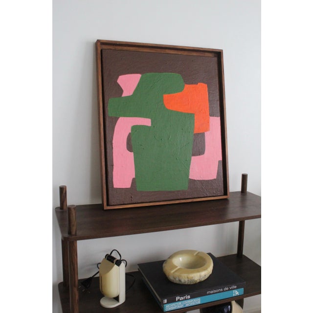 This abstract painting is a bold celebration of form and color, where deep green and earthy brown contrast beautifully...