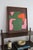This abstract painting is a bold celebration of form and color, where deep green and earthy brown contrast beautifully...
