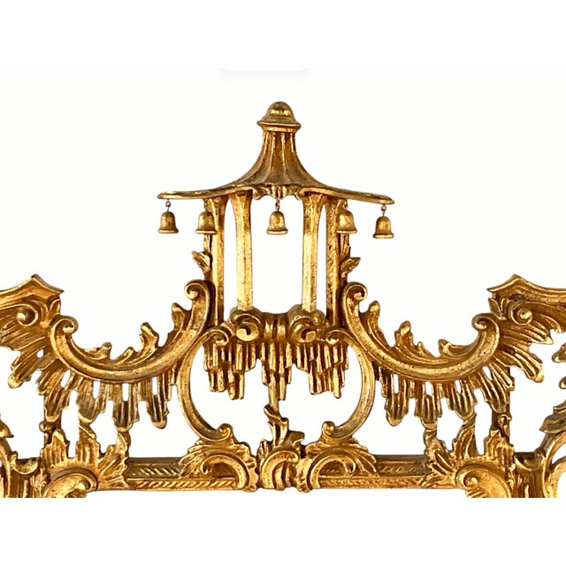Chinese Chippendale Style Giltwood Mirror. Mirror is hand-carved with elaborate openwork scrolls, foliate motifs, and an...