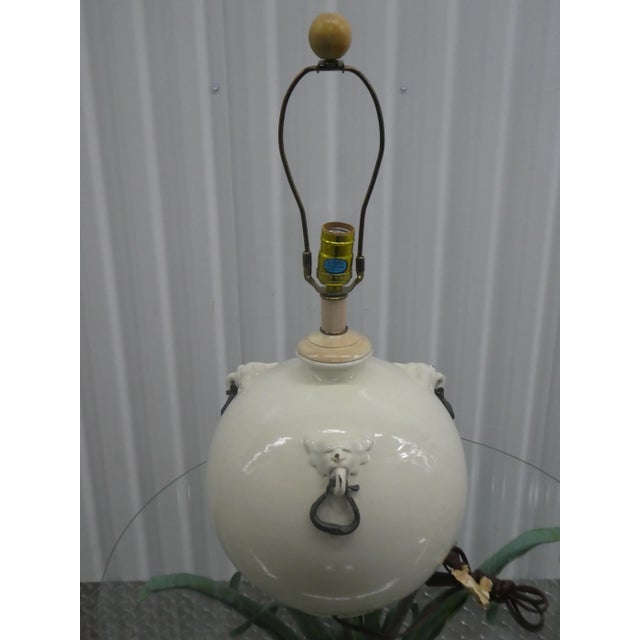 Vintage Italian glazed terra cotta lamp with lion heads with iron pulls. Sold as found in vintage condition without...