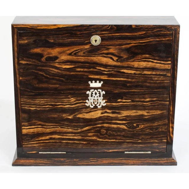 A very fine antique victorian coromandel writing or stationary cabinet made by the world famous london box makers and...