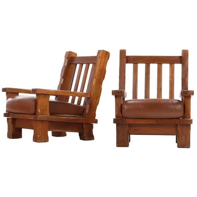 A striking example of mid-century European craftsmanship, this pair of lounge chairs embodies the bold, sculptural...