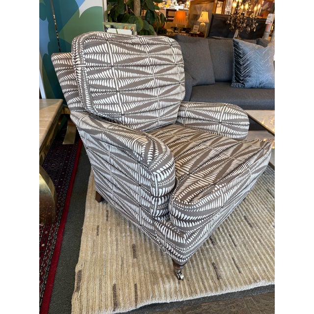 Design Plus Gallery presents a Lounge Armchair by Lee Industries for Grace Home Furnishings. The chair has a taupe-gray...