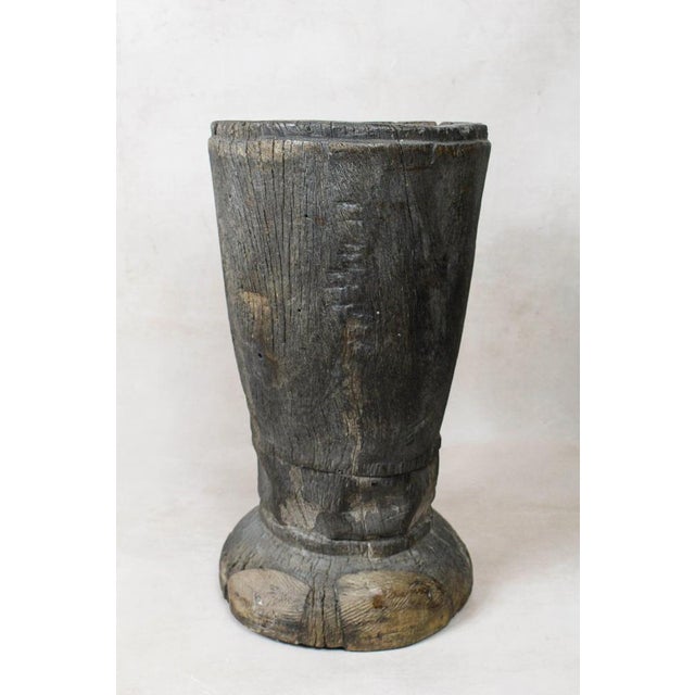 African grain stompers are made when they hollow out tree trucks and large branches to create these which are then used to...