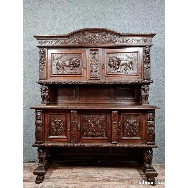 Two-part renaissance-style buffet in solid walnut, circa 1850. the fully carved front opens with five doors. decorated...