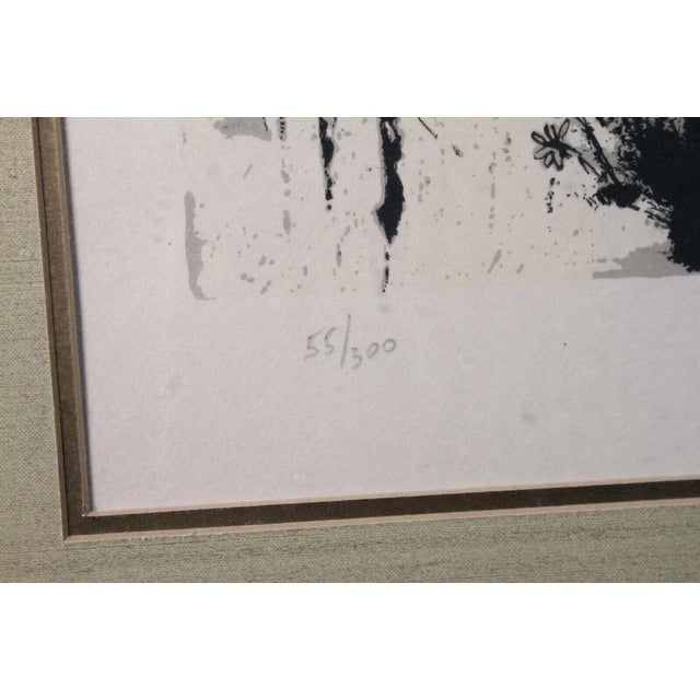 A surreal and fascinating lithograph on paper titled “L’Age d’Or” from the suite by “Don Quichotte de la Mancha” by...