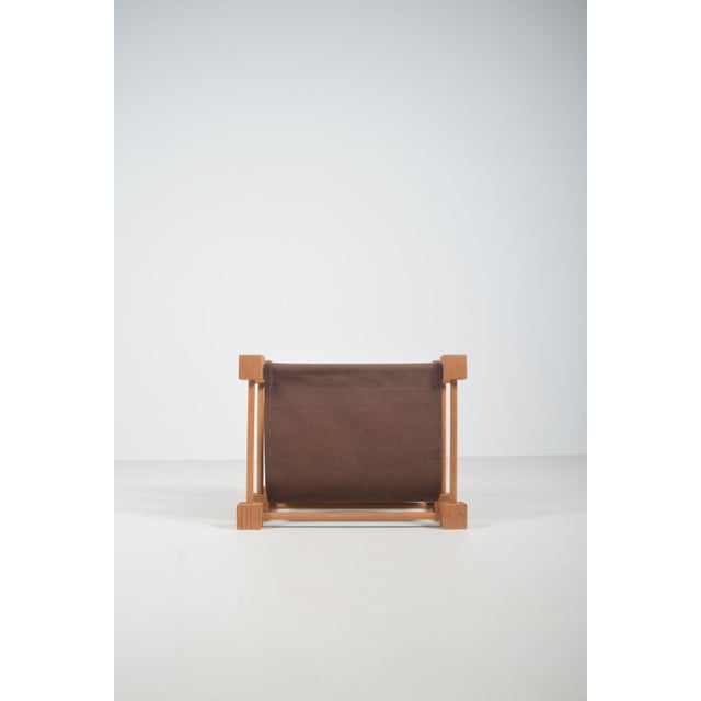 Double magazine rack from the 1960s with a wooden frame and linen. This magazine rack is in beautiful vintage condition.