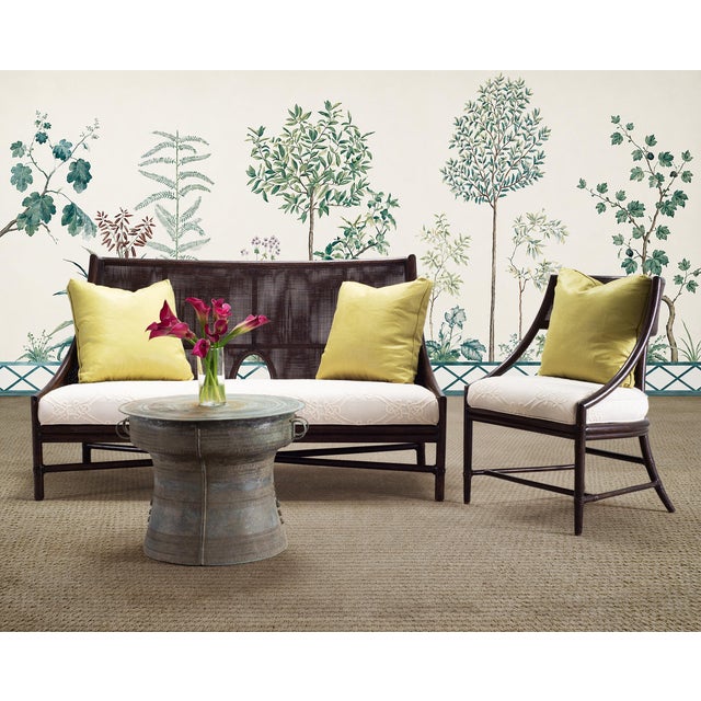 A rare pair of exceptional cane and rattan living room suite designed by Barbara Barry for McGuire in San Francisco, CA....