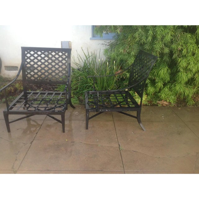 Modern pair of Modern patio lounge chairs. Frames are powder coated aluminum/iron combo. Frames are in good condition. The...