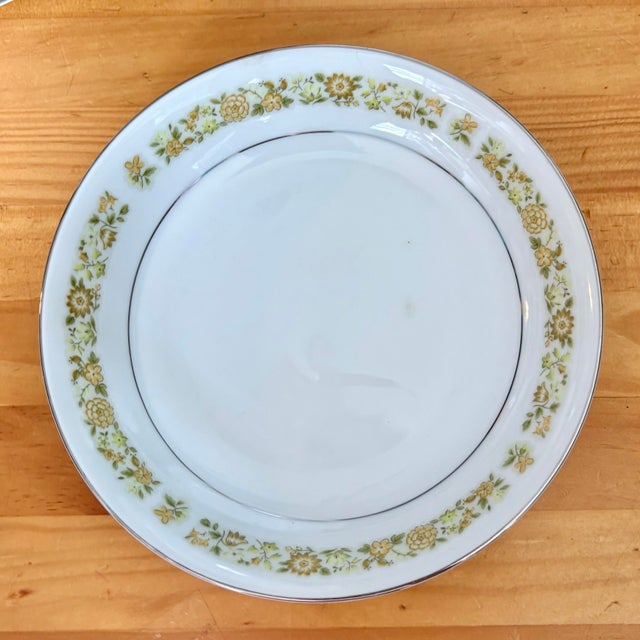 Vintage Towne House “Spring 3094” soup bowls, featuring a delicate band of yellow florals accented with a subtle silver...