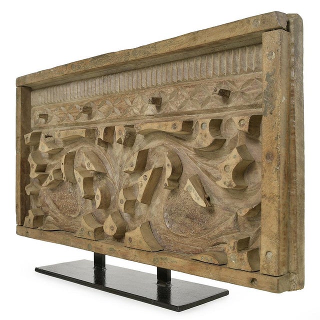 Antique carved wooden panel, richly decorated with vegetal scrolls and two facing birds, a work of great craftsmanship....