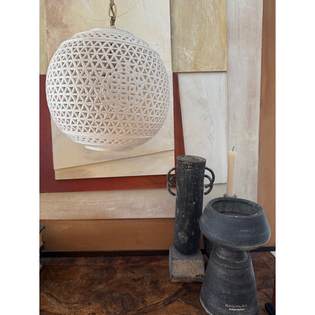 This elegant mid-century chinoiserie swag light is crafted in classic Blanc de Chine–style white porcelain, featuring an...