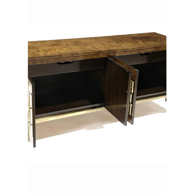 Attributed to William Doezema For Mastercraft Burl and Brass Greek Key Credenza is a stylish and elegant piece of...