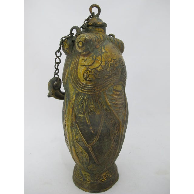 Archaic style antique Chinese bronze vessel, modeled after ritual bronze ware from the Western Zho Dynasty. Portable wine...
