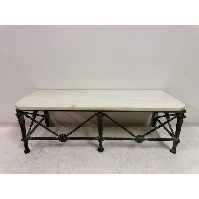 A refined wall-mounted console table combining sculptural bronze work with the understated elegance of marble. The...