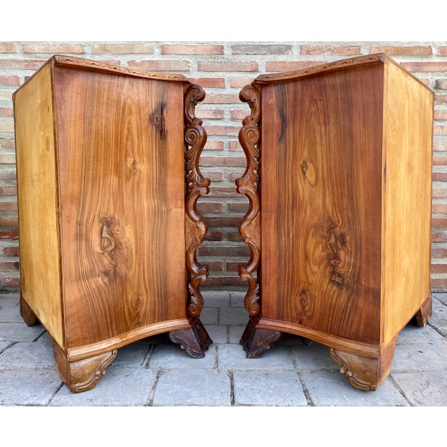 Having butterfly form tops and drawers with rounded corners and molded edges above conforming cases housing three drawers,...