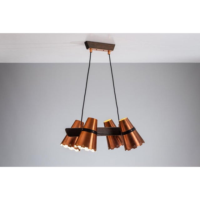 This Swedish ceiling lamp is a stunning blend of timeless design and functional elegance. At the heart of the lamp, a...