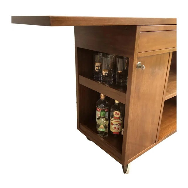 Mid-Century Modern bar, tea or buffet serving cart by Edward Wormley for Dunbar. Marked with metal Dunabr tag in drawer....