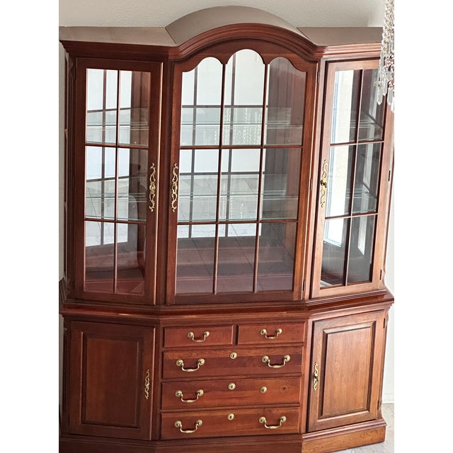 Pennsylvania House Hallmark Cherry Canted Front China and Buffet 64W x 18D x 83H 2 adjustable glass shelves, a mirror...