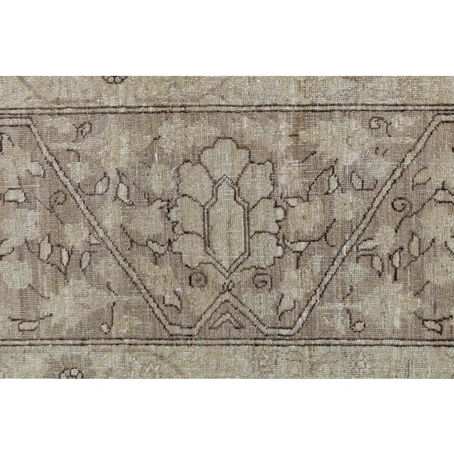 This hand-knotted wool rug draws inspiration from the rich heritage of Tabriz weaving, reinterpreting its classic motifs...