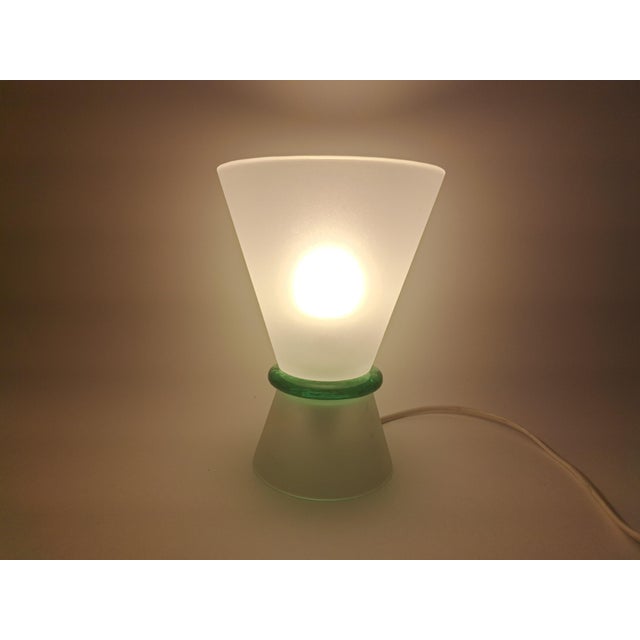 The Murano glass lamp was made by the Effetre glassworks in the 1980s. The style is modern and minimalist. The shape is...