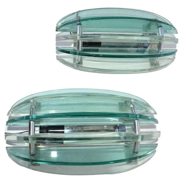 Pair of Italian sconces in clear & green glass Panels. Featuring seven alternating pieces of glass on a chrome base. US...