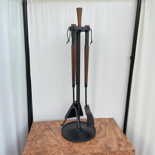 Set of three fireplace tools made with wood, leather, iron and a type of animal hair for the broom’s bristles. This set...